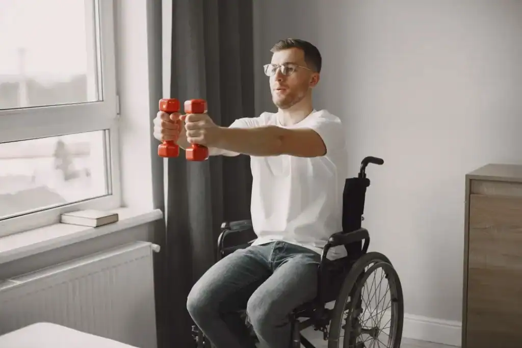 Empowering Weight Loss: A Comprehensive Guide for Individuals with Disabilities 1 Image of man doing exercise in his wheelchair to aid weight loss Horley