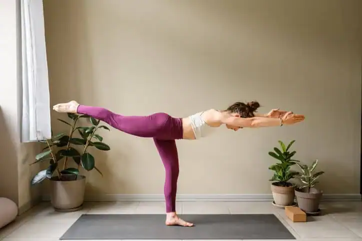 Woman doing Yoga exercise Horley to help with toning the body. 