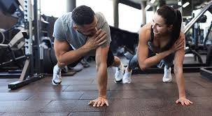 Image of man and woman doing Cardio Horley to tone their arms. 
